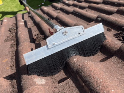 Cleaning Roof with stiff brush